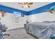 Comfortable bedroom with a large window offering pleasant views, accented by a blue ceiling at 2261 Shadow Trace Way, Greenwood, IN 46143