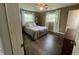 Cozy bedroom with a comfortable bed, soft lighting, and views of the outdoors at 247 N 150 W, Greenfield, IN 46140