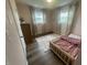 Cozy bedroom with two windows, wooden floors, and plenty of natural light at 247 N 150 W, Greenfield, IN 46140