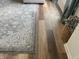 Close-up of the durable wood-look flooring and stylish rug, adding warmth and charm to the home at 247 N 150 W, Greenfield, IN 46140