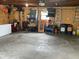 Spacious garage with ample storage space, tools, and concrete flooring at 247 N 150 W, Greenfield, IN 46140