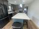 Open kitchen with island, stainless appliances, and a modern aesthetic at 247 N 150 W, Greenfield, IN 46140