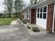 Landscaped area in front of the home with a walkway and well-maintained garden beds at 247 N 150 W, Greenfield, IN 46140