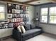 Cozy living room with a large record collection display and a comfortable grey couch at 247 N 150 W, Greenfield, IN 46140