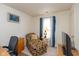 Bright room with an accent chair and a lamp next to a window at 2623 Santaro Ct, Indianapolis, IN 46217