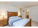 Inviting bedroom featuring a queen-sized bed, matching nightstands, and an ensuite bathroom with a full vanity at 2623 Santaro Ct, Indianapolis, IN 46217