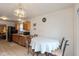Kitchen and dining area with ample lighting, stainless steel appliances, and wood cabinetry at 2623 Santaro Ct, Indianapolis, IN 46217