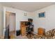 Bright room featuring a wooden desk and patterned accent chair at 2623 Santaro Ct, Indianapolis, IN 46217