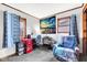 Cozy bedroom featuring decoratively draped windows, home office setup and comfortable seating at 2625 N Boehning St, Indianapolis, IN 46219
