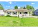 Charming home featuring a cozy front porch and well-maintained lawn at 2625 N Boehning St, Indianapolis, IN 46219