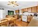 Bright kitchen with wooden cabinets and a cozy dining area at 2625 N Boehning St, Indianapolis, IN 46219