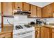 Well-equipped kitchen with white appliances and functional layout at 2625 N Boehning St, Indianapolis, IN 46219