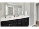 Bright bathroom with double vanity and sleek black cabinets at 2972 W Patchwork Dr, Monrovia, IN 46157