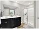 En suite bathroom features double vanity, a mirror, and walk in shower at 2972 W Patchwork Dr, Monrovia, IN 46157