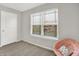 Cozy bedroom featuring a large window and comfortable pink chair at 2972 W Patchwork Dr, Monrovia, IN 46157