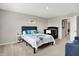 Bedroom features a cozy queen size bed, a black crib, a couch, and grey walls at 2972 W Patchwork Dr, Monrovia, IN 46157