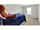 Spacious bedroom with a bed, a dresser and natural light at 2972 W Patchwork Dr, Monrovia, IN 46157