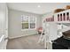 Bright bedroom with a loft bed, neutral walls, carpeted floors, a window with blinds, and a cozy chair at 2972 W Patchwork Dr, Monrovia, IN 46157