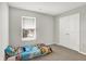 Comfortable bedroom with gray walls, plush carpet, a window with blinds, and a double door closet at 2972 W Patchwork Dr, Monrovia, IN 46157