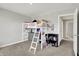 Inviting bedroom showcases a loft bed with ladder, complemented by neutral walls and carpeted floors at 2972 W Patchwork Dr, Monrovia, IN 46157