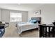 Bedroom features a queen size bed, crib, grey walls, and natural light at 2972 W Patchwork Dr, Monrovia, IN 46157