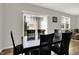 Dining room with sliding glass doors to the yard and six-chair dining set at 2972 W Patchwork Dr, Monrovia, IN 46157