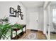 Bright entryway with wood floors, a decorative rug, console table, and a unique wall display at 2972 W Patchwork Dr, Monrovia, IN 46157