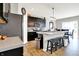 Well-equipped kitchen features stainless steel appliances, island with seating, and sleek cabinetry at 2972 W Patchwork Dr, Monrovia, IN 46157