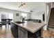 Open concept kitchen features a large island with stainless steel sink and dishwasher at 2972 W Patchwork Dr, Monrovia, IN 46157