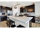 Spacious kitchen showcasing a kitchen island, black cabinets, and stainless steel appliances at 2972 W Patchwork Dr, Monrovia, IN 46157