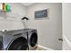 Functional laundry room featuring modern appliances and storage at 2972 W Patchwork Dr, Monrovia, IN 46157