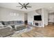 Inviting living room featuring a sectional sofa, a ceiling fan, and a wall-mounted TV at 2972 W Patchwork Dr, Monrovia, IN 46157