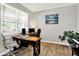 Well-lit office area showcasing a wooden desk, comfortable seating, and a peaceful atmosphere at 2972 W Patchwork Dr, Monrovia, IN 46157