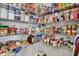 Walk-in pantry has metal shelving stocked with food and other goods at 2972 W Patchwork Dr, Monrovia, IN 46157