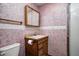 Small bathroom with wood vanity and mirror, features a shower with glass doors at 305 Cardinal Dr, Whiteland, IN 46184