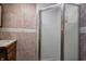 Ensuite bathroom featuring a glass-enclosed shower and a traditional vanity at 305 Cardinal Dr, Whiteland, IN 46184