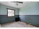 Bedroom with blue walls and window provides relaxing personal space at 305 Cardinal Dr, Whiteland, IN 46184