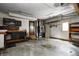 Large garage with workbench, storage, and access to outside at 305 Cardinal Dr, Whiteland, IN 46184