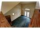 Overhead view of the living room highlighting the high ceilings, carpet, built-in shelving, and abundant light at 305 Cardinal Dr, Whiteland, IN 46184