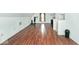 Spacious attic with wood laminate flooring and workout equipment at 312 S Center St, Plainfield, IN 46168