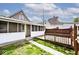 The house has a screened-in porch and wooden deck, accessible via a stone walkway at 312 S Center St, Plainfield, IN 46168