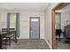 Cozy entryway features shiplap walls, gray door, and dark wood floors at 312 S Center St, Plainfield, IN 46168