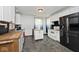 Bright kitchen with modern appliances, butcher block countertops, and stylish slate-look flooring at 312 S Center St, Plainfield, IN 46168