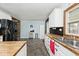 Spacious kitchen featuring butcher block countertops, white cabinets, and modern appliances at 312 S Center St, Plainfield, IN 46168