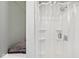 Clean shower with clear curtain and built in shelves at 312 S Center St, Plainfield, IN 46168
