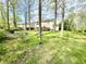 Spacious backyard featuring a wooden deck and ample seating area at 4223 Kestrel Ct, Indianapolis, IN 46254
