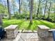 Backyard featuring a seating area and lush green trees at 4223 Kestrel Ct, Indianapolis, IN 46254