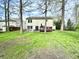 Lush backyard with patio and deck, perfect for outdoor living and entertaining at 4223 Kestrel Ct, Indianapolis, IN 46254