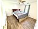 Bedroom with wood-look flooring, ceiling fan and natural light at 4223 Kestrel Ct, Indianapolis, IN 46254