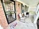 Cozy porch with rocking chairs, decorative welcome mat, and brick accents at 4223 Kestrel Ct, Indianapolis, IN 46254